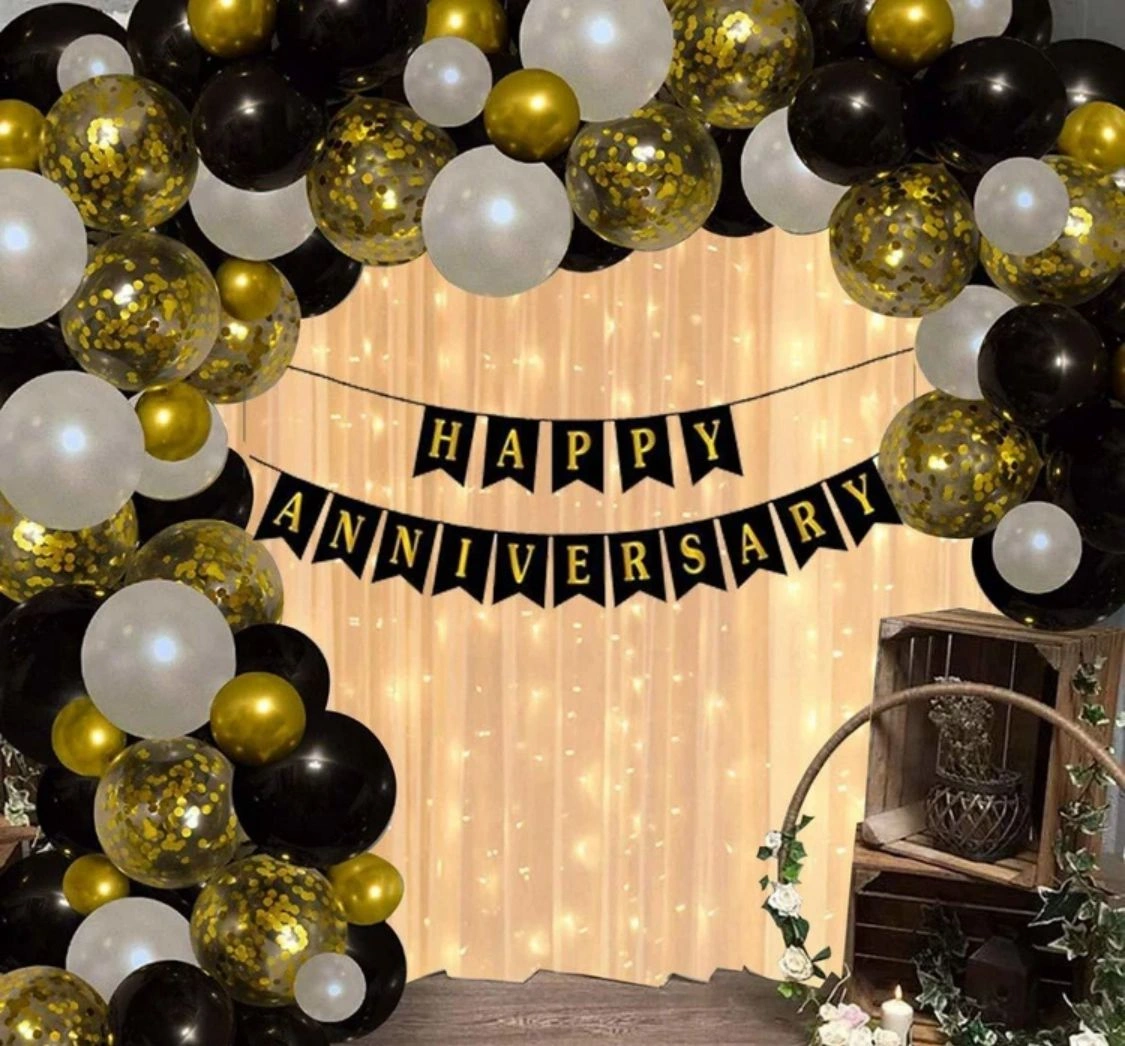 Golden anniversary theme with gold accents and floral arrangements