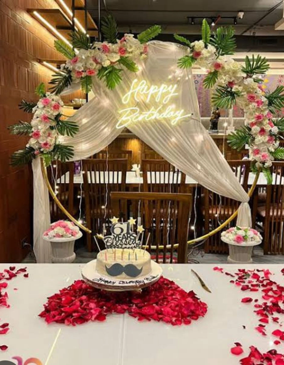 Garden romance theme with floral arches and fairy lights